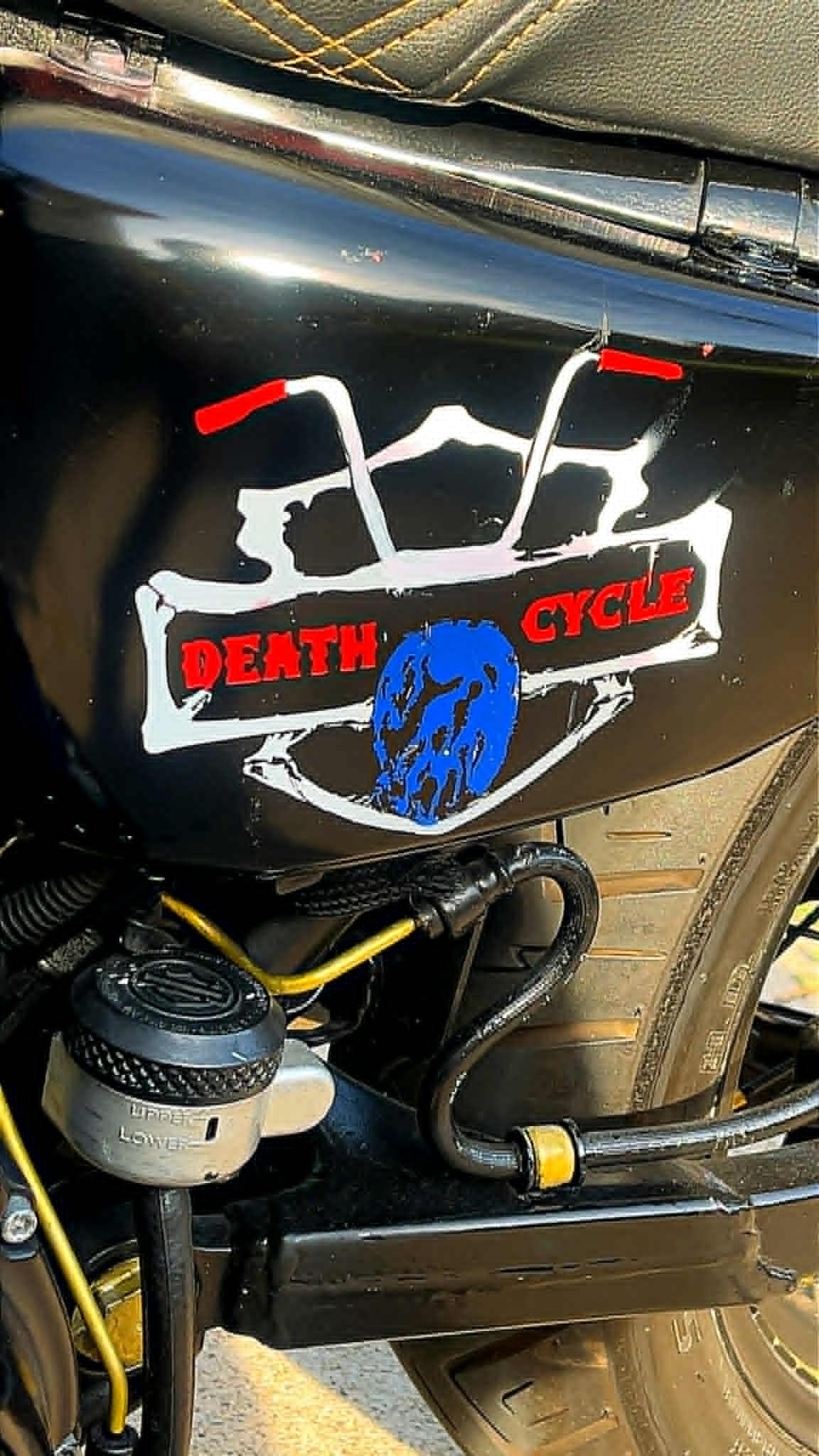 Finished gloss-black Sportster tank with red and white Death Cycle graphic